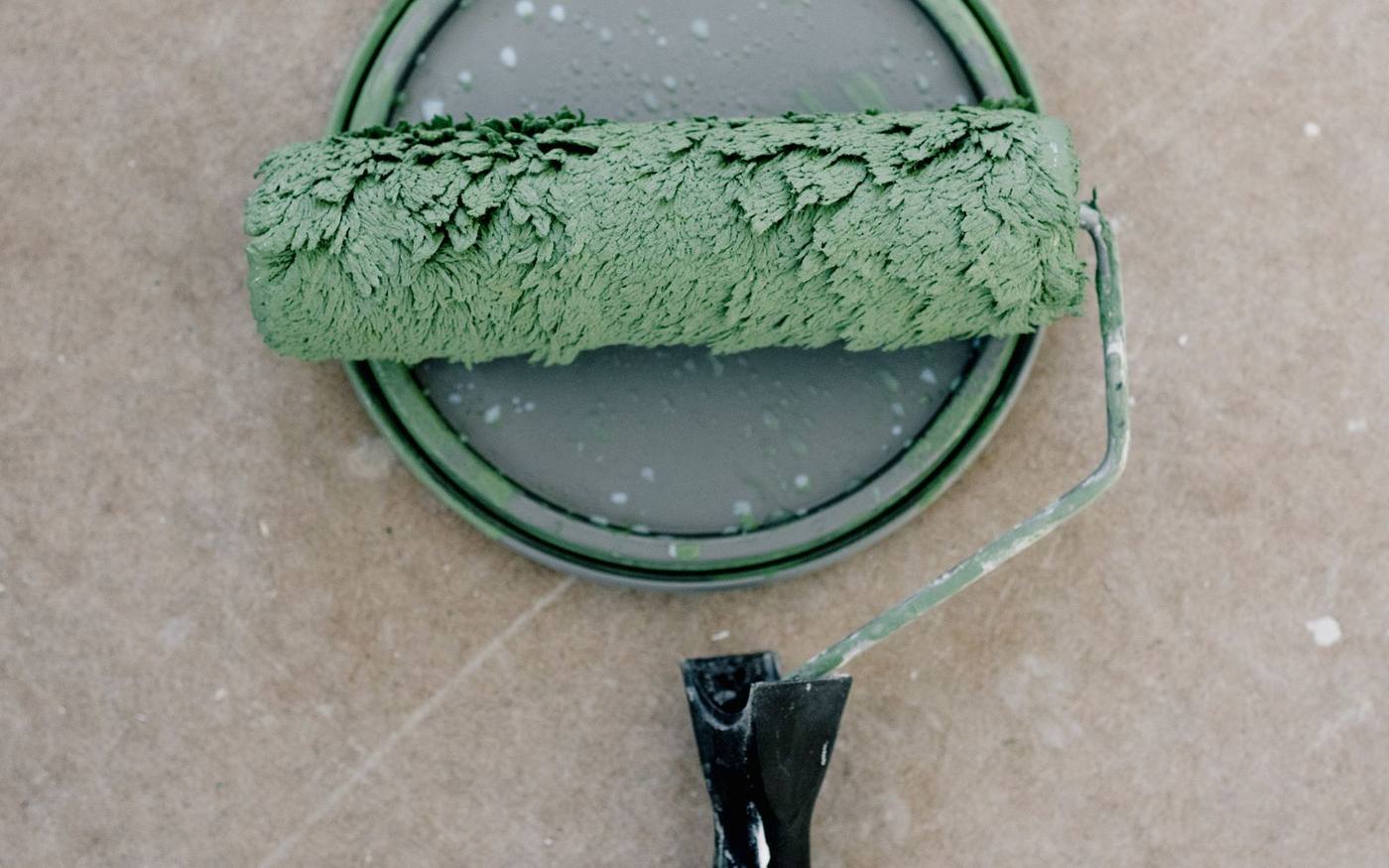 Plumber working a bathroom leak — the kind of call we dry behind